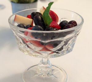 Fresh fruit cup with mint garnish